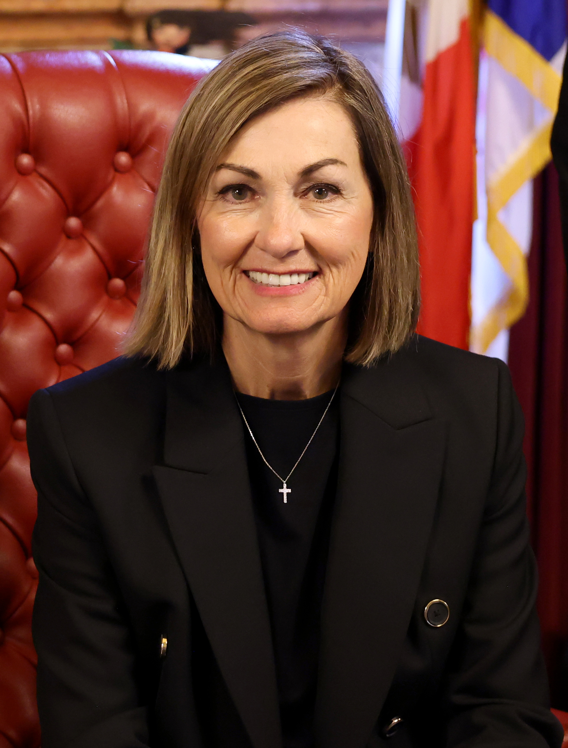 Portrait of Kim Reynolds, rendered as a two-tone print